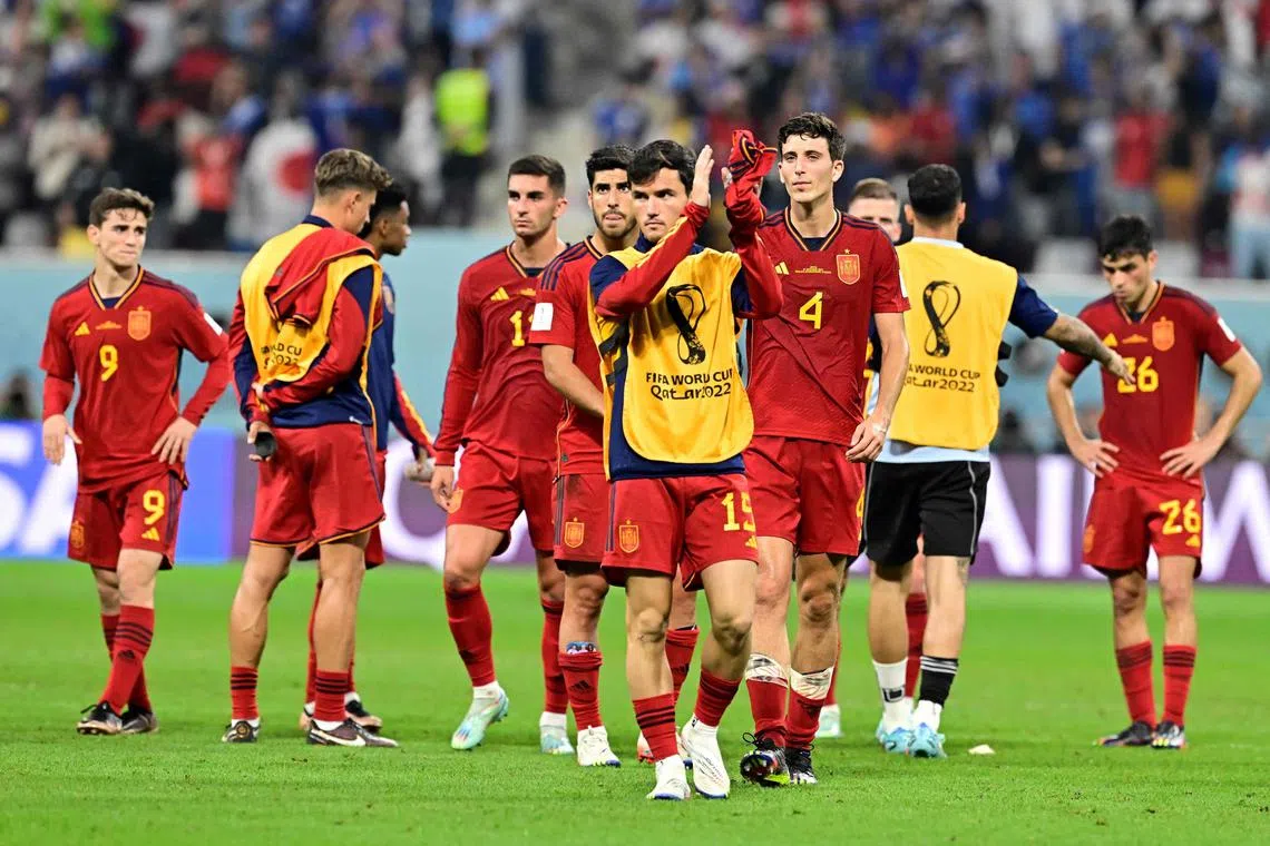 Spain's players react after they suffered a shock loss to Japan on Thursday. 