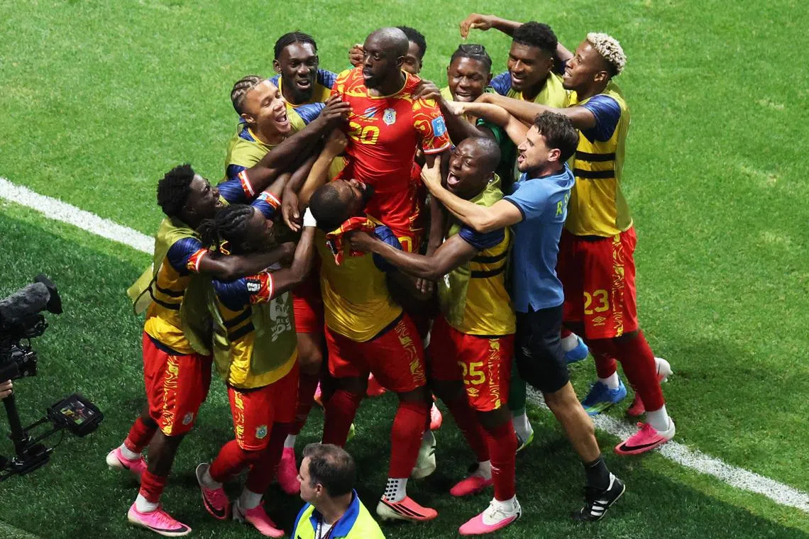 DR Congo’s Yoane Wissa celebrates scoring their third goal with his teammates.
