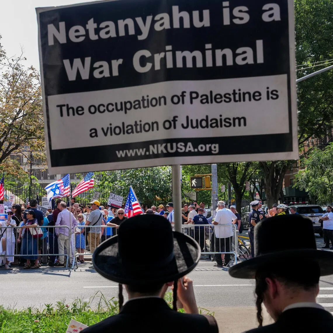 Ultra-Orthodox Jews from the anti-Zionist Neturei Karta organisation counter-protest as people attend a pro-Jewish rally in opposition to New York City Mayor Zohran Mamdani in New York City on July 26.
