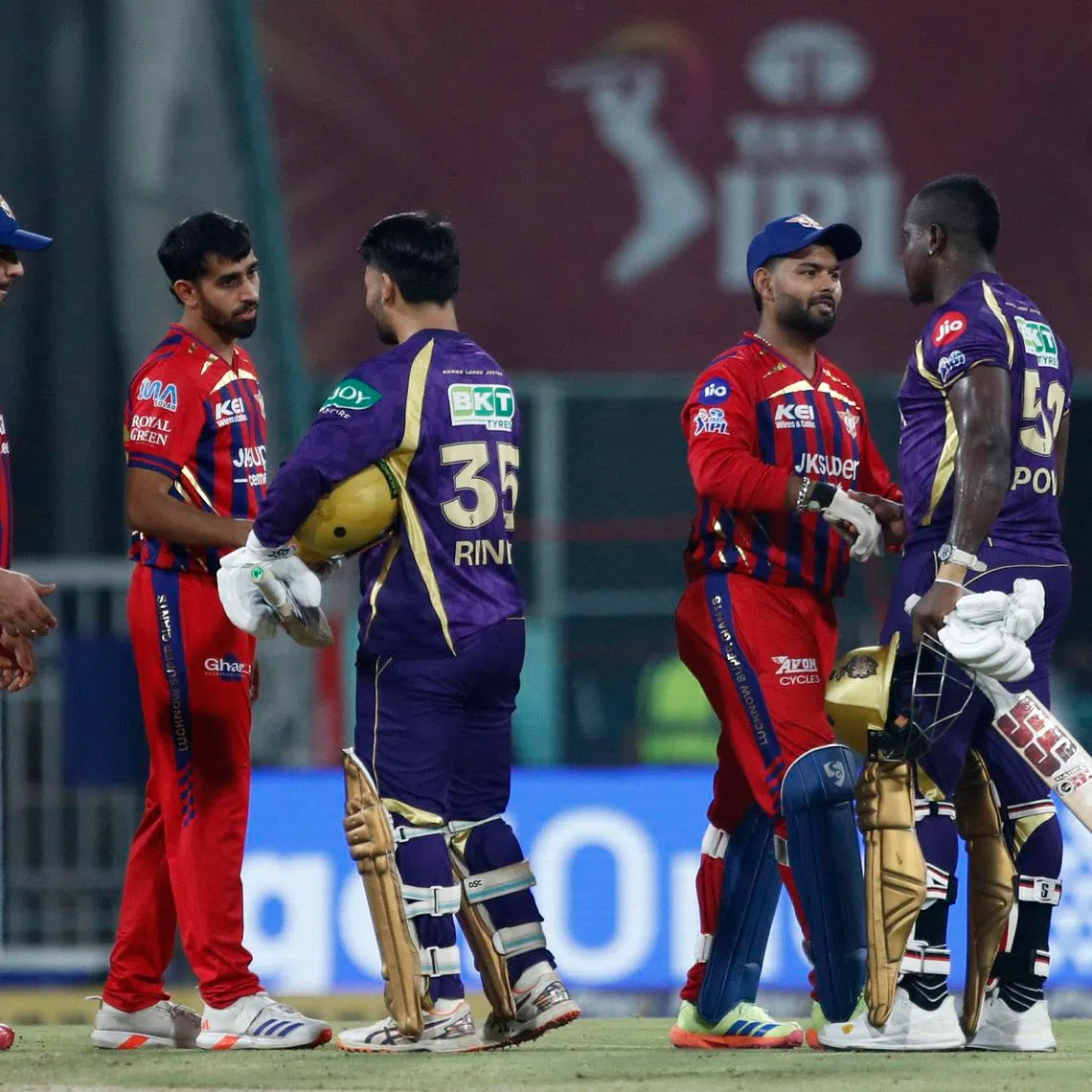 Cricket - Indian Premier League - IPL - Lucknow Super Giants v Kolkata Knight Riders - Bharat Ratna Shri Atal Bihari Vajpayee Ekana Cricket Stadium, Lucknow, India - April 26, 2026 Kolkata Knight Riders' Rinku Singh and Rovman Powell shake hands with Lucknow Super Giants' Rishabh Pant and Prince Yadav after the match REUTERS/Mihir Singh