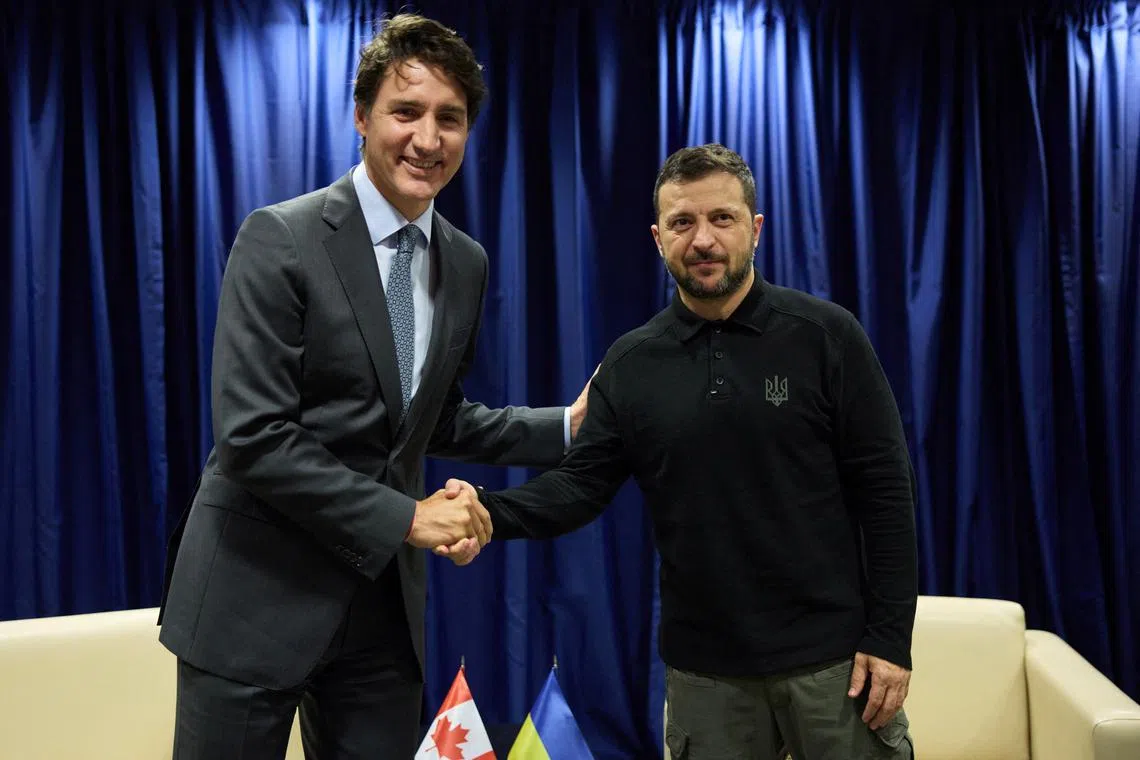 Ukraine's President Volodymyr Zelenskiy and Canadian Prime Minister Justin Trudeau shake hands before their meeting during the United Nations General Assembly summit in New York City, U.S., September 24, 2024. Ukrainian Presidential Press Service/Handout via REUTERS/File Photo