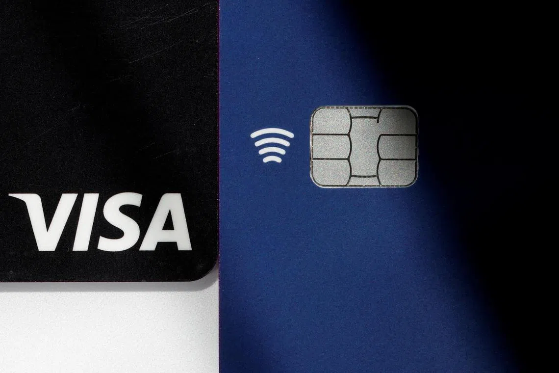 Visa credit and debit cards are seen in this picture illustration taken August 2, 2022. REUTERS/Benoit Tessier/File Photo