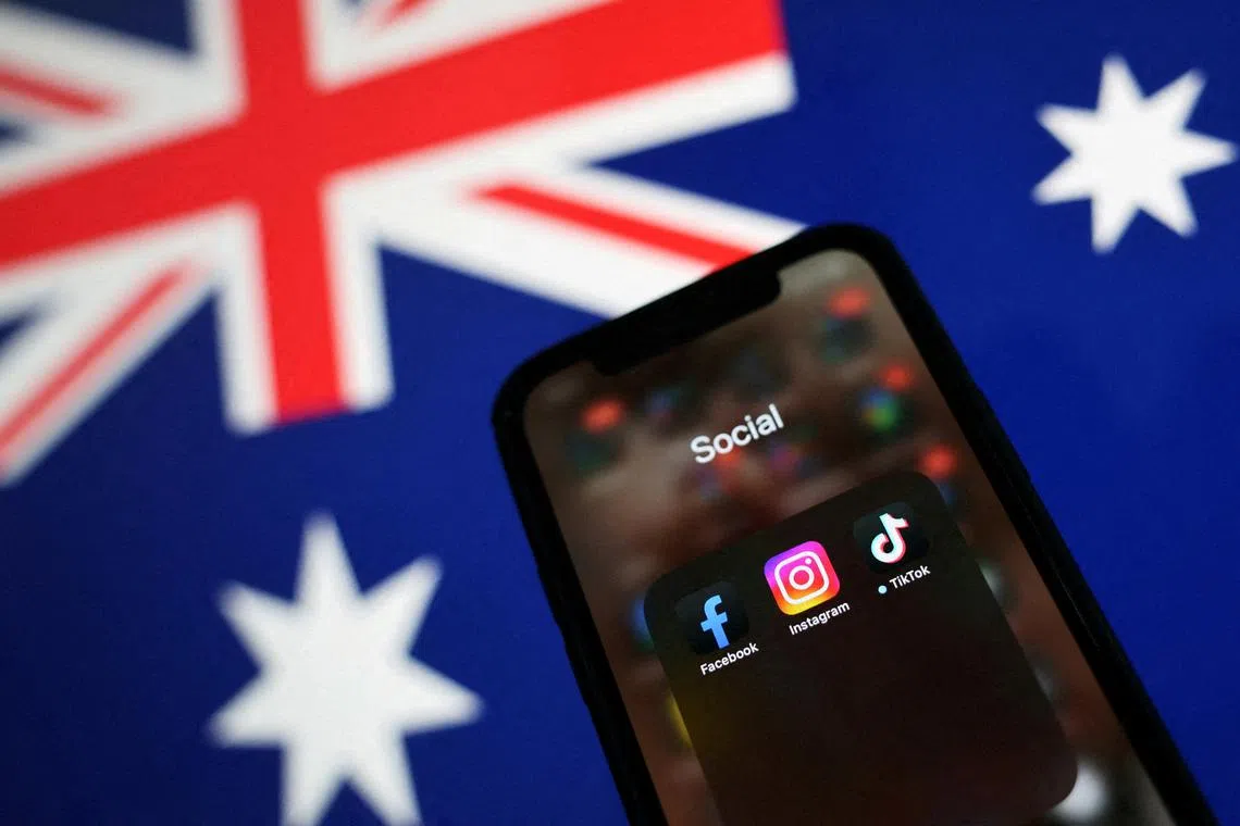 FILE PHOTO: Facebook, Instagram and TikTok apps are seen on a smartphone in front of an Australian flag, in this illustration taken November 29, 2024. REUTERS/Edgar Su/Illustration/File Photo