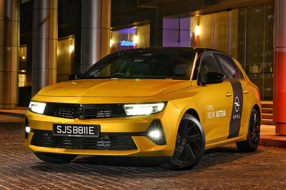 The sixth generation Opel Astra has gone from sleek and sexy to sharp and sporty. 
The hatchback now sports a blackout “blitz” logo on a glossy black grille that fits seamlessly between the angular headlights. The 17-inch black wheels on the yellow test car complements the black roof in a dual colour scheme.
******
Opel Astra photographed on August 14, 2023.
Life motoring review of Opel Astra