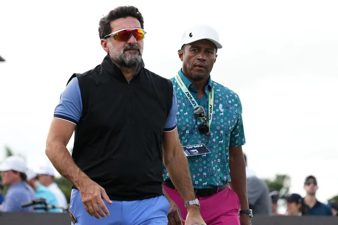 Yasir Al-Rumayyan (left) with Saudi Golf Federation CEO Majed Al-Sorour during the season finale of the LIV Golf series at Trump National Doral in Miami in October 2022.