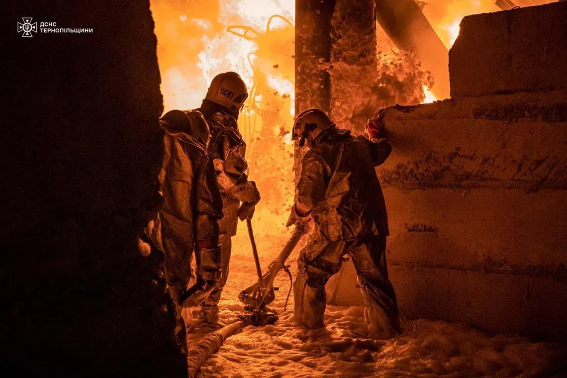 Rescuers working at the site of a Russian drone strike, amid Russia's attack on Ukraine, in Ternopil, Ukraine, Nov 26, 2024. 