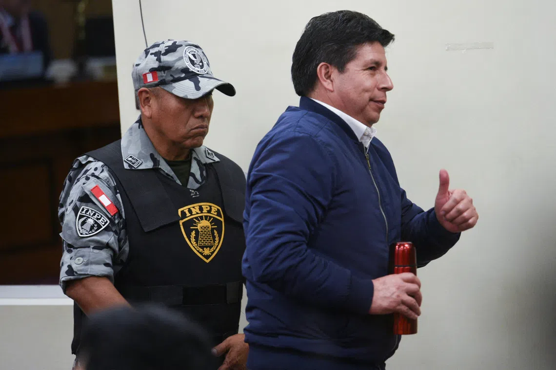 Peru’s former leftist President Pedro Castillo gestures at a court hearing during his trial for rebellion and conspiracy against the state, following his failed attempt to dissolve Congress and assume broad powers in late 2022, in Lima, Peru, November 27, 2025. REUTERS/Luis Julian