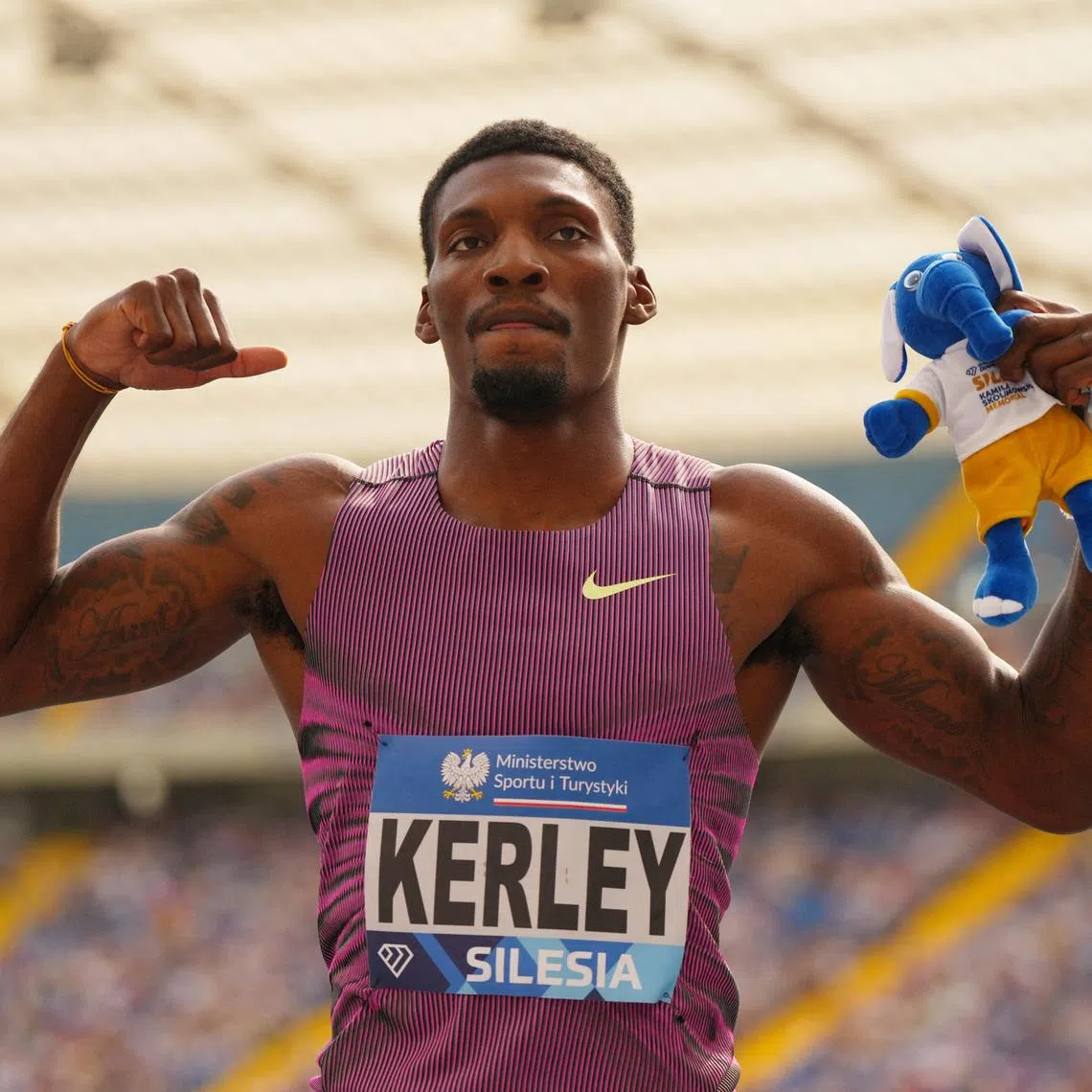 Athletics - Diamond League - Silesia  - Silesian Stadium, Chorzow, Poland - August 25, 2024 Fred Kerley of the U.S. celebrates after winning the men's 100m REUTERS/Aleksandra Szmigiel