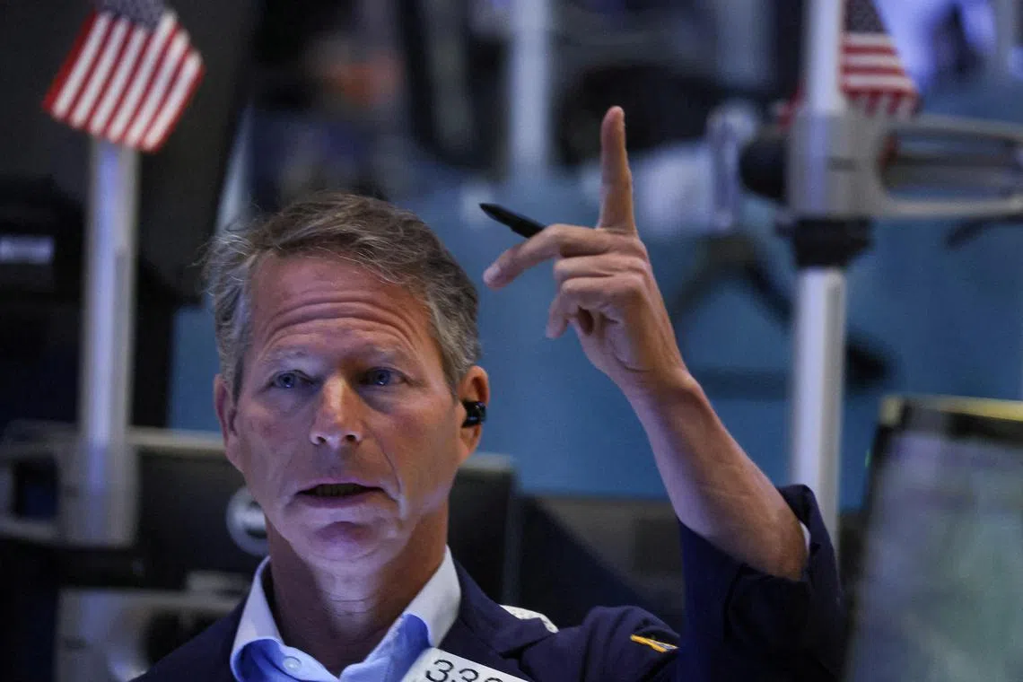 A trader works on the floor of the New York Stock Exchange.
