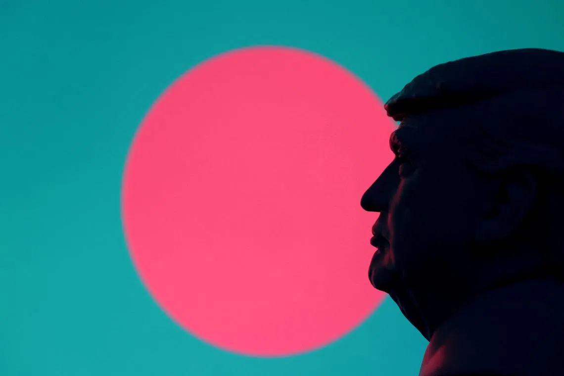 FILE PHOTO: A 3D-printed miniature model of U.S. President Donald Trump and the Bangladesh flag are seen in this illustration taken July 23, 2025. REUTERS/Dado Ruvic/Illustration/File Photo