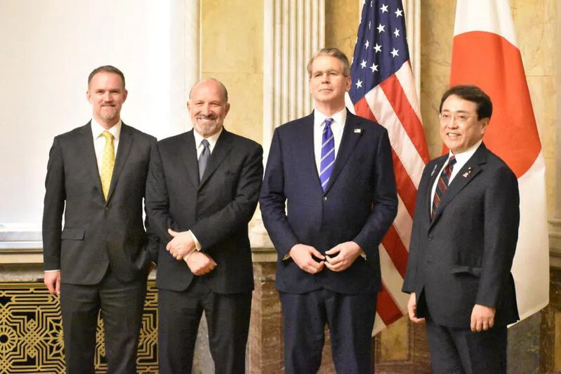 Japan's Economic Revitalisation Minister Ryosei Akazawa (R) poses with US Treasury Secretary Scott Bessent (2nd R), Commerce Secretary Howard Lutnick (3rd R) and US Trade Representative Jamieson Greer (L) in Washington DC on May 1, 2025. (Photo by AFP)