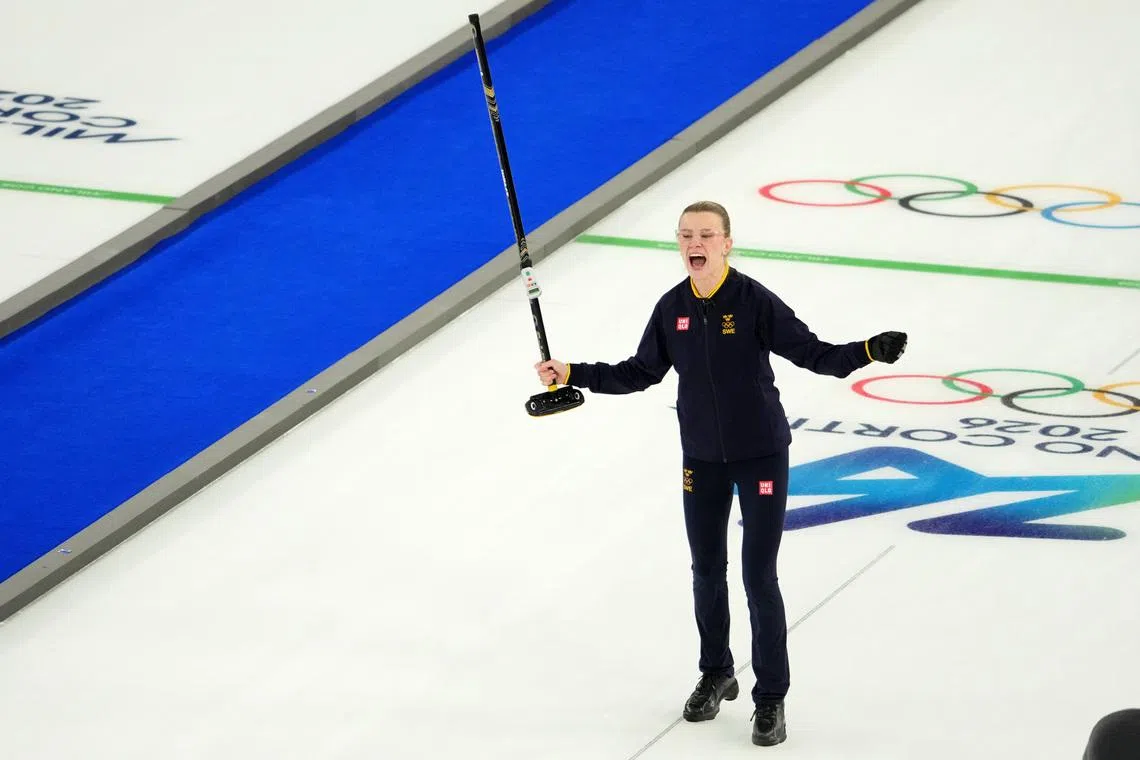 Feb 10, 2026; Cortina d'Ampezzo, Italy; Isabella Wranaa of Sweden celebrates after winning the curling mixed doubles gold medal game during the Milano Cortina 2026 Olympic Winter Games at Cortina Curling Olympic Stadium. Mandatory Credit: Eric Bolte-Imagn Images