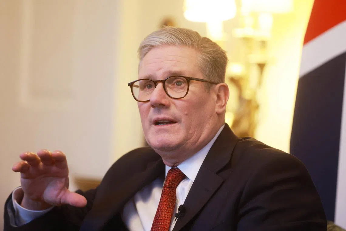 FILE PHOTO: British Prime Minister Keir Starmer meets Paralympic Silver Medallist Blaine Hunt with Bobby Bansal and Kay Bansal in London, Britain, November 29, 2024. Ian Vogler/Pool via REUTERS/File photo