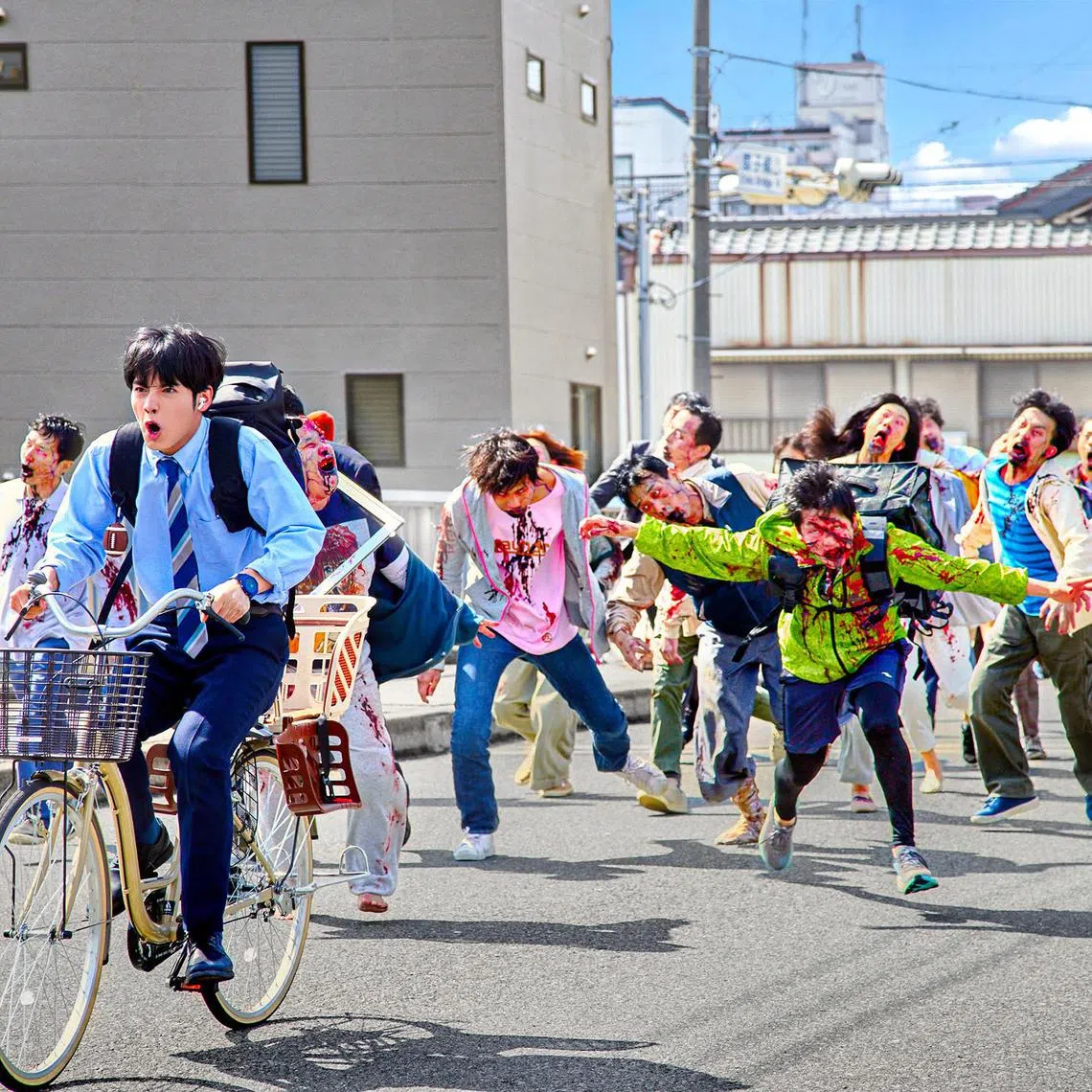 jasneaks02 - Eiji Akaso (in blue on bicycle) plays a salaryman trying to do 100 things on his bucket list amid a zombie apocalypse. 

PHOTO: NETFLIX