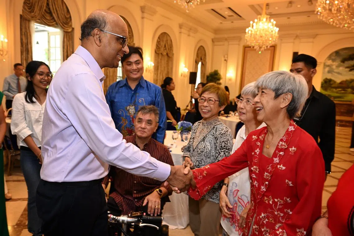 President Tharman Shanmugaratnam shaking hands with Madam Goh Pheck Hong at the 2024 Chingay Parade appreciation reception at the Istana on Feb 28.