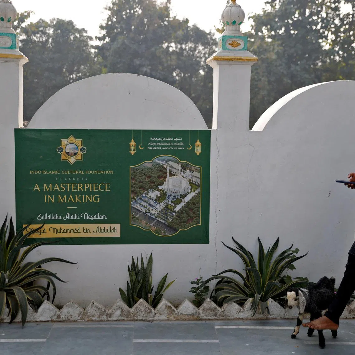 FILE PHOTO: A Muslim man walks his goat at a site that was allotted by the authorities for a new mosque, about 15 miles from the Hindu Ram Temple, in Ayodhya in the northern state of Uttar Pradesh, India, November 23, 2023. REUTERS/Anushree Fadnavis/File Photo