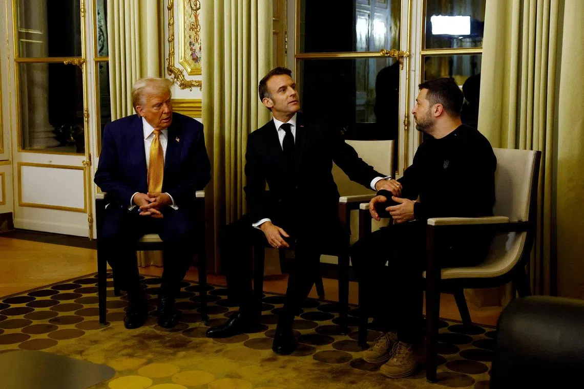 FILE PHOTO: French President Emmanuel Macron, U.S. President-elect Donald Trump and Ukraine's President Volodymyr Zelenskiy attend a trilateral meeting at the Elysee Palace in Paris as part of ceremonies to mark the reopening of the Notre-Dame de Paris Cathedral, five-and-a-half years after a fire ravaged the Gothic masterpiece, after its restoration, France, December 7, 2024. REUTERS/Piroschka van de Wouw/File Photo