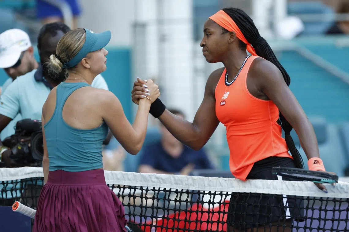 Anastasia Potopova (left) shakes hands with Coco Gauff after their match.