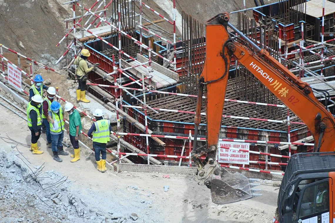 pixgeneric/ Generic picture of foreign migrant construction workers in Dakota One BTO construction site on 1 September 2022 . 
Work place safety and health Act . 
The Ministry of Manpower is imposing a period of "heightened safety" from Sept 1, 2022 to Feb 28, 2023 to stem the tide of workplace deaths
 • A company can be barred from employing new foreign employees for up to three months if found to have poor safety conditions after a serious or fatal accident
 • It will also be mandatory for companies in industries such as construction and manufacturing to review their safety procedures from Sept 1 to 15
 • MOM will increase the demerit points issued to construction firms for major injury and dangerous occurrences.
