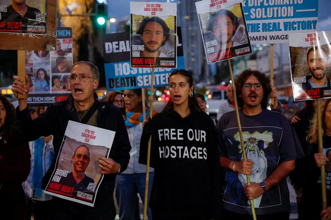 FILE PHOTO: Dana Shem Tov, sister of Omer Shem Tov, 21, an Israeli hostage kidnapped on the deadly October 7 attack on Israel by Palestinian Islamist group Hamas from Gaza, shouts slogans next to other relatives, friends and supporters during a rally calling for the hostages' release, amid the ongoing conflict in Gaza between Israel and Hamas, outside the Israeli Ministry of Defense, in Tel Aviv, Israel, March 7, 2024. REUTERS/Carlos Garcia Rawlins/File Photo