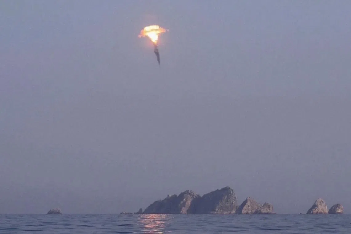 A screen grab from a video shows an undated image of a ballistic missile test at an undisclosed location.