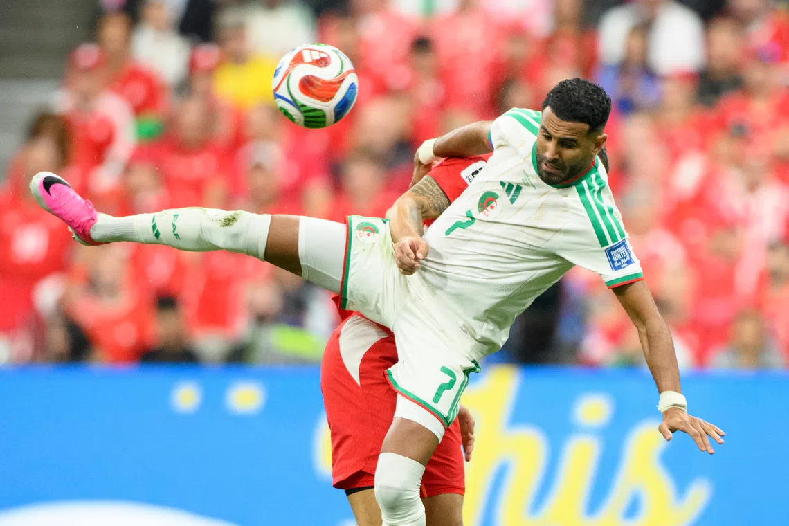 Jul 2, 2026; Vancouver, British Columbia, CAN; Algeria forward Riyad Mahrez (7) battles for the ball against Switzerland midfielder Ruben Vargas (17) during the first half during a Round of 32 match in the 2026 FIFA World Cup at BC Place Vancouver. Mandatory Credit: Anne-Marie Sorvin-Imagn Images