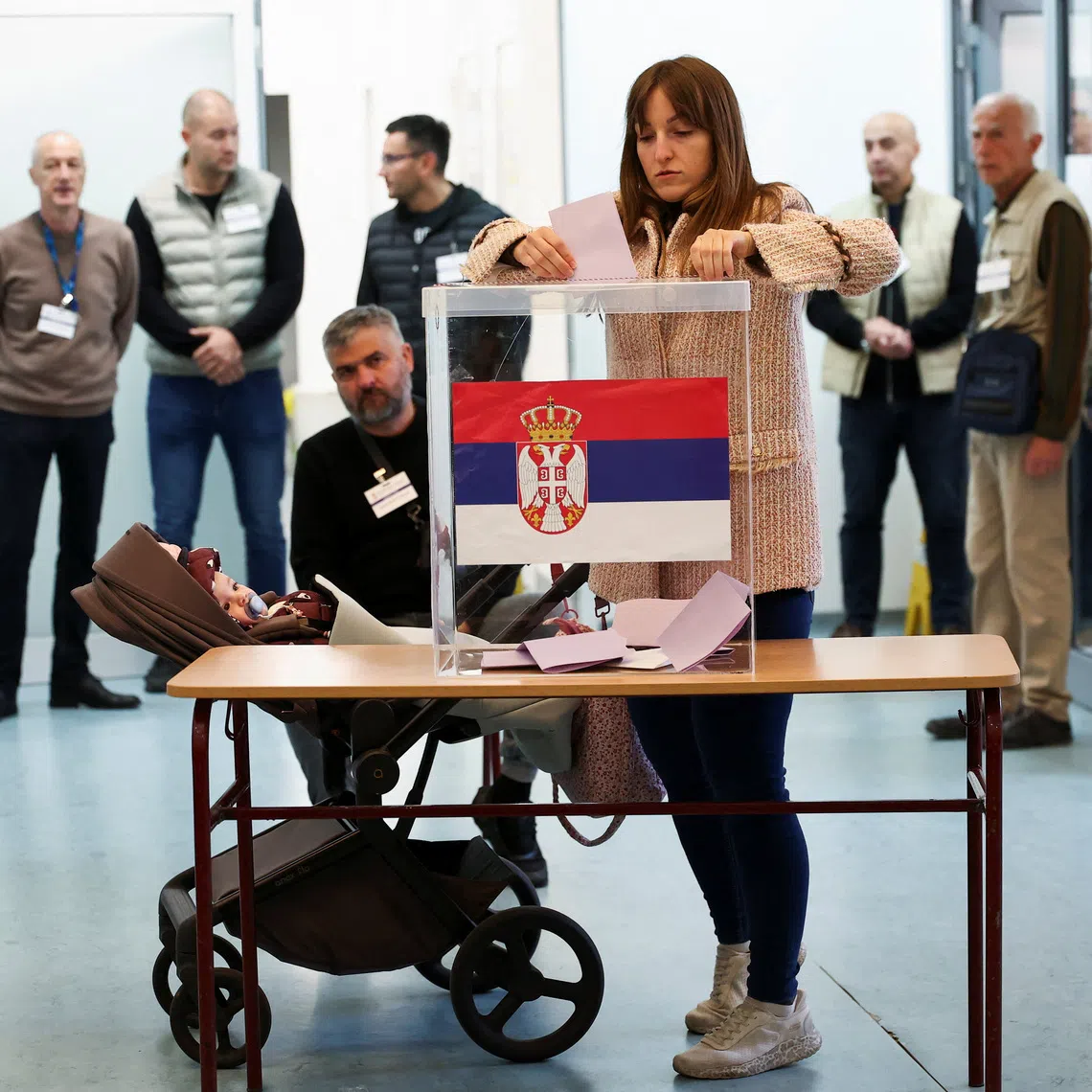 A woman votes at a polling station during the parliamentary election in Belgrade, Serbia, October 25, 2026. REUTERS/Zorana Jevtic