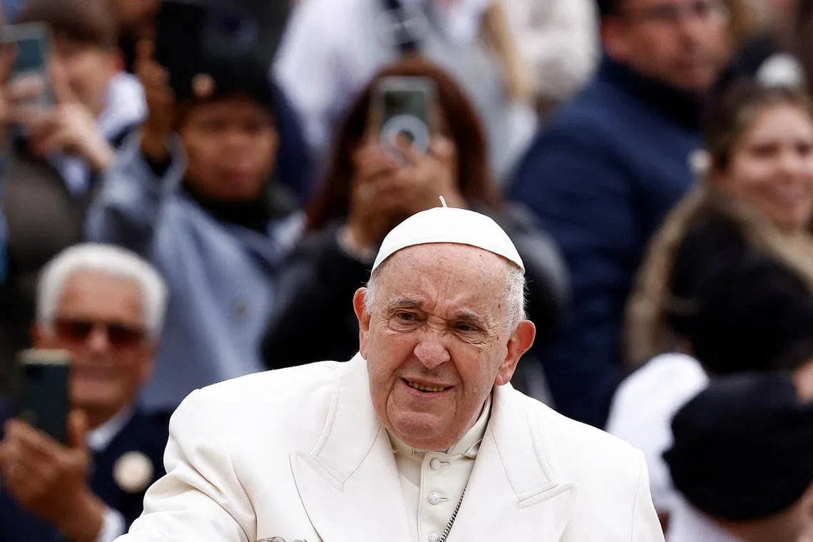 Pope Francis looks on during the day of the weekly general audience in St. Peter's Square at the Vatican, April 3, 2024. REUTERS/Guglielmo Mangiapane/File Photo