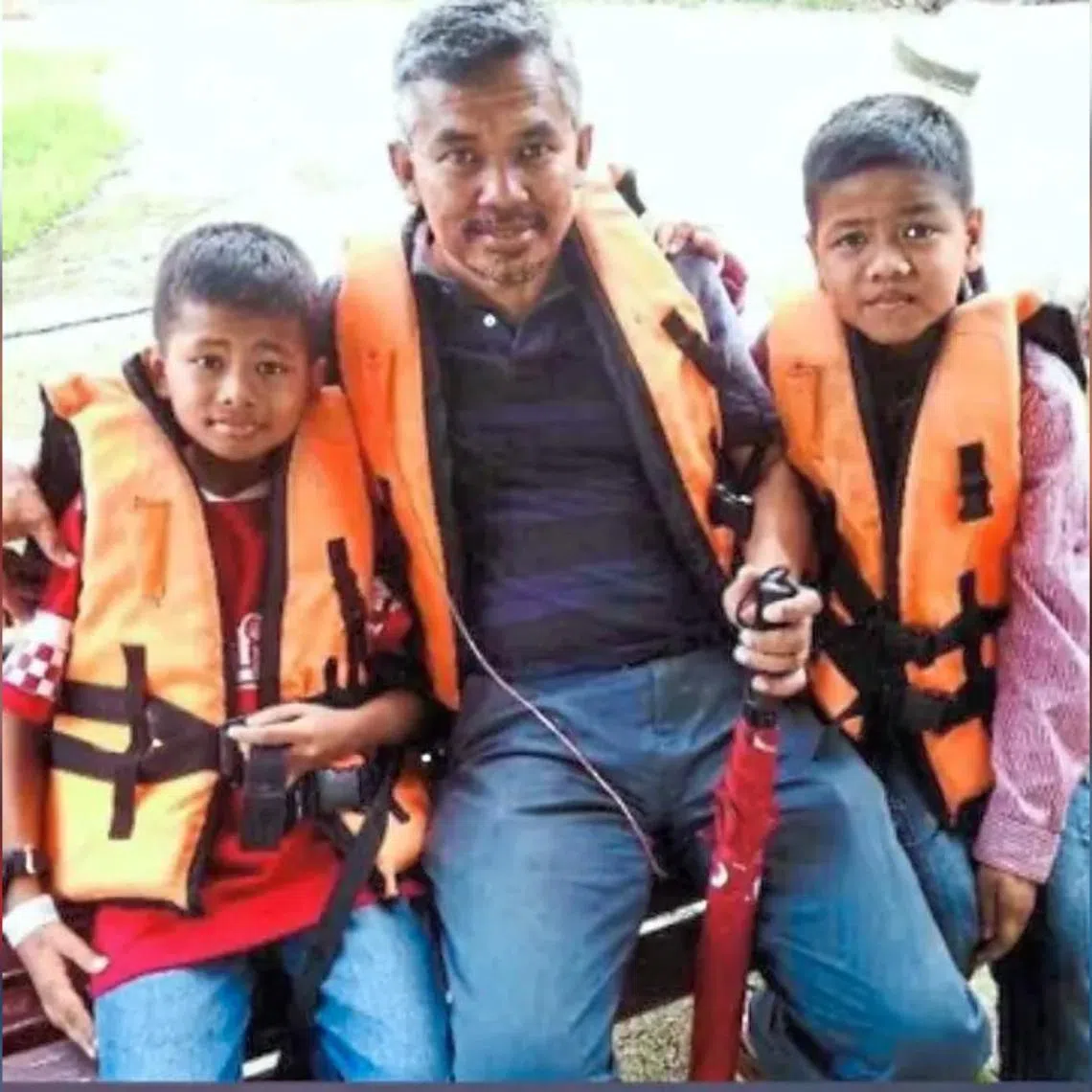 Mr Wan Yusuf Irfan (left) on vacation with his late father Wan Amran (middle) and brother Wan Uzair in this old photo courtesy of the boys’ mother.