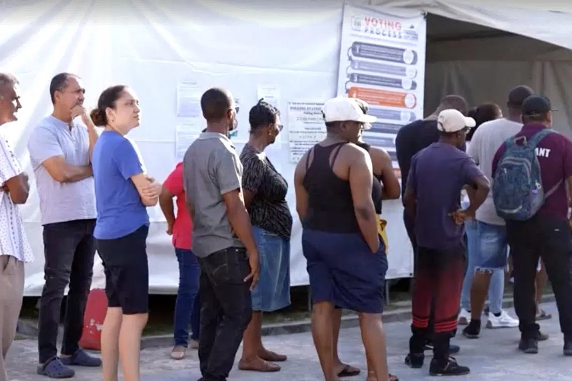 People wait to cast their vote during the general election in Georgetown, Guyana, September 1, 2025, in this screen grab taken from a video. Reuters TV/via REUTERS