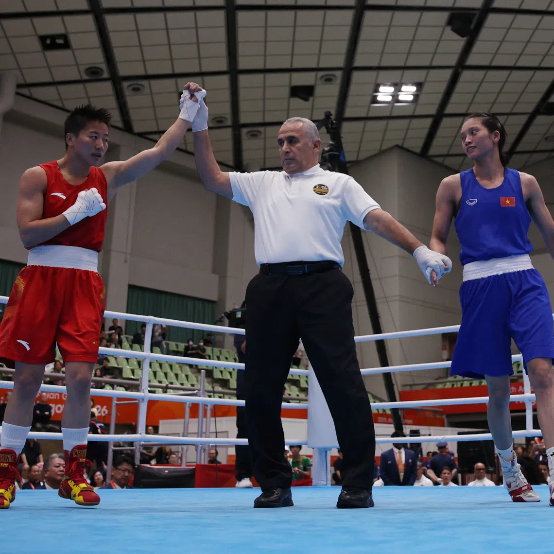 Taiwan’s Lin Yu-ting celebrates after winning against China’s Yang Chengyu in the women’s 60kg final on Oct 2.