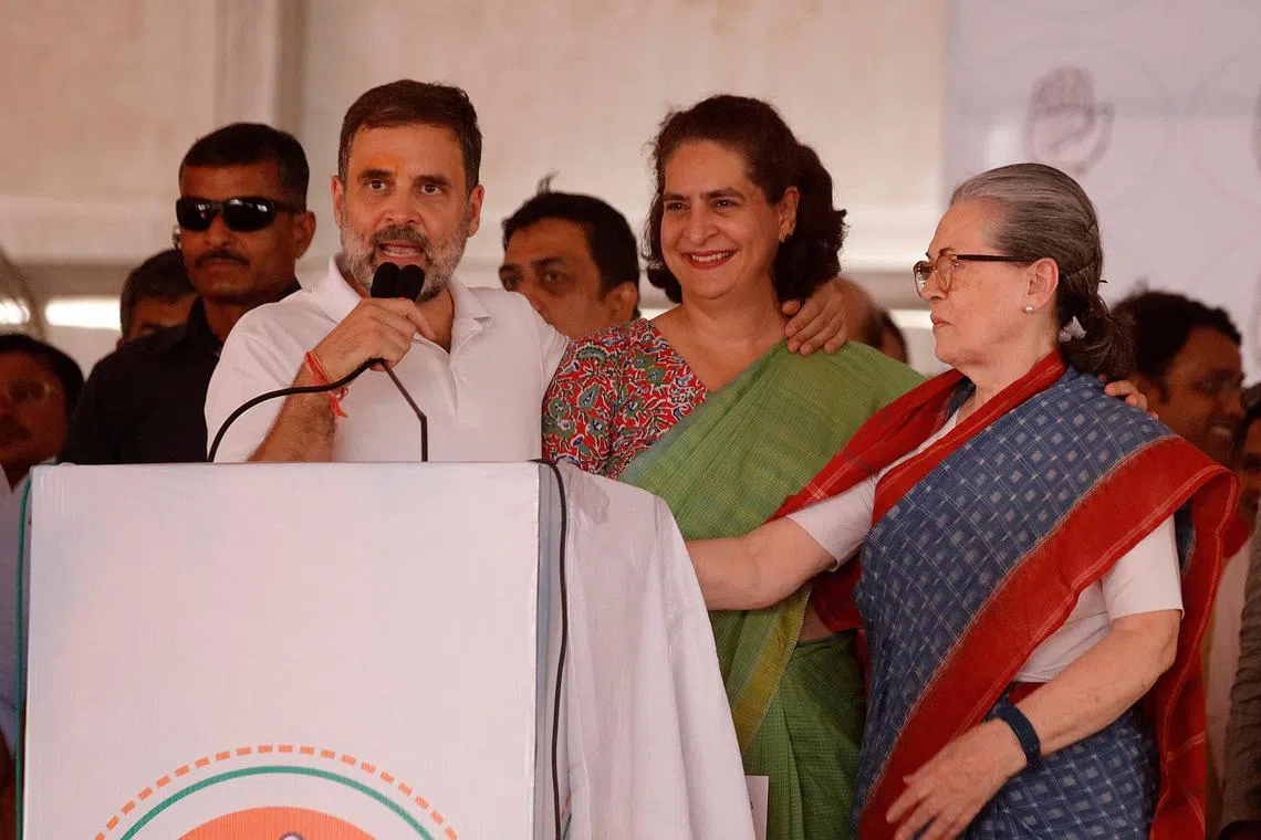 Rahul Gandhi, a senior leader of India's main opposition Congress party, addresses his supporters as his sister Priyanka Gandhi Vadra, and their mother Sonia Gandhi look on during an election campaign rally in Raebareli in the state of Uttar Pradesh, India, May 17, 2024. REUTERS/Pawan Kumar