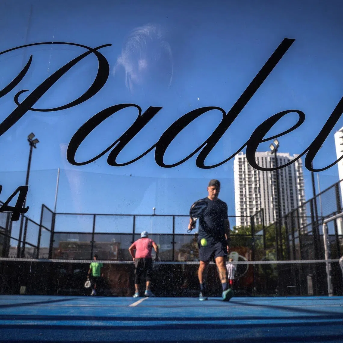 People play padel on a court in Miami, Florida, on March 22, 2026. Padel, the racket sport that originated among the elites of Latin America and Spain, has exploded in popularity in Miami. Fans say it will conquer the rest of the United States, and the world.