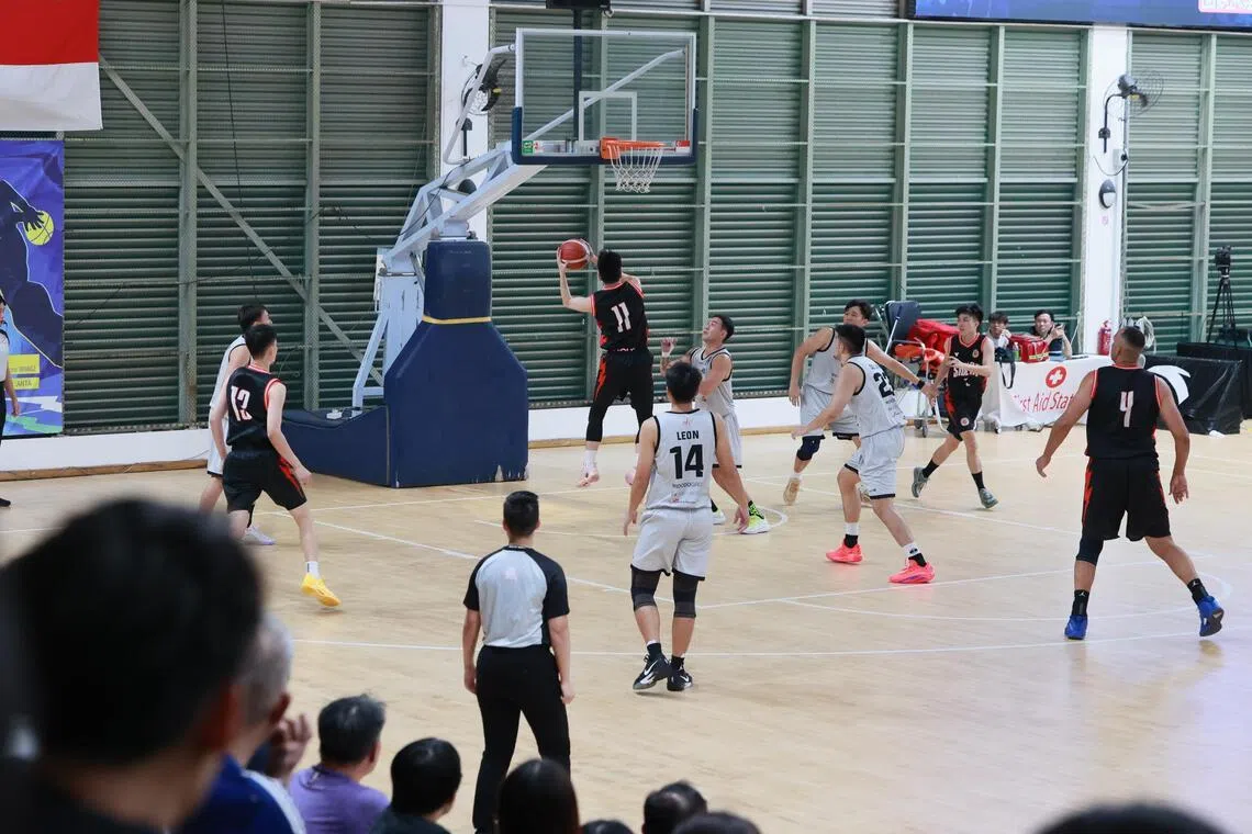 Adroit HB (in white) playing Siglap Basketball Club in a National Basketball League Division 1 semi-final clash on Aug 27, 2025. Adroit won 67-52, but were later disqualified for fielding two players under investigation for match-fixing.