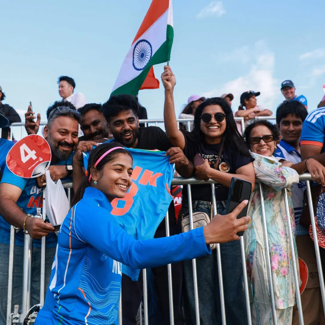India’s Shreyanka Patil poses with supporters after their victory in the women’s gold-medal cricket match between India and Sri Lanka on Sept 22.