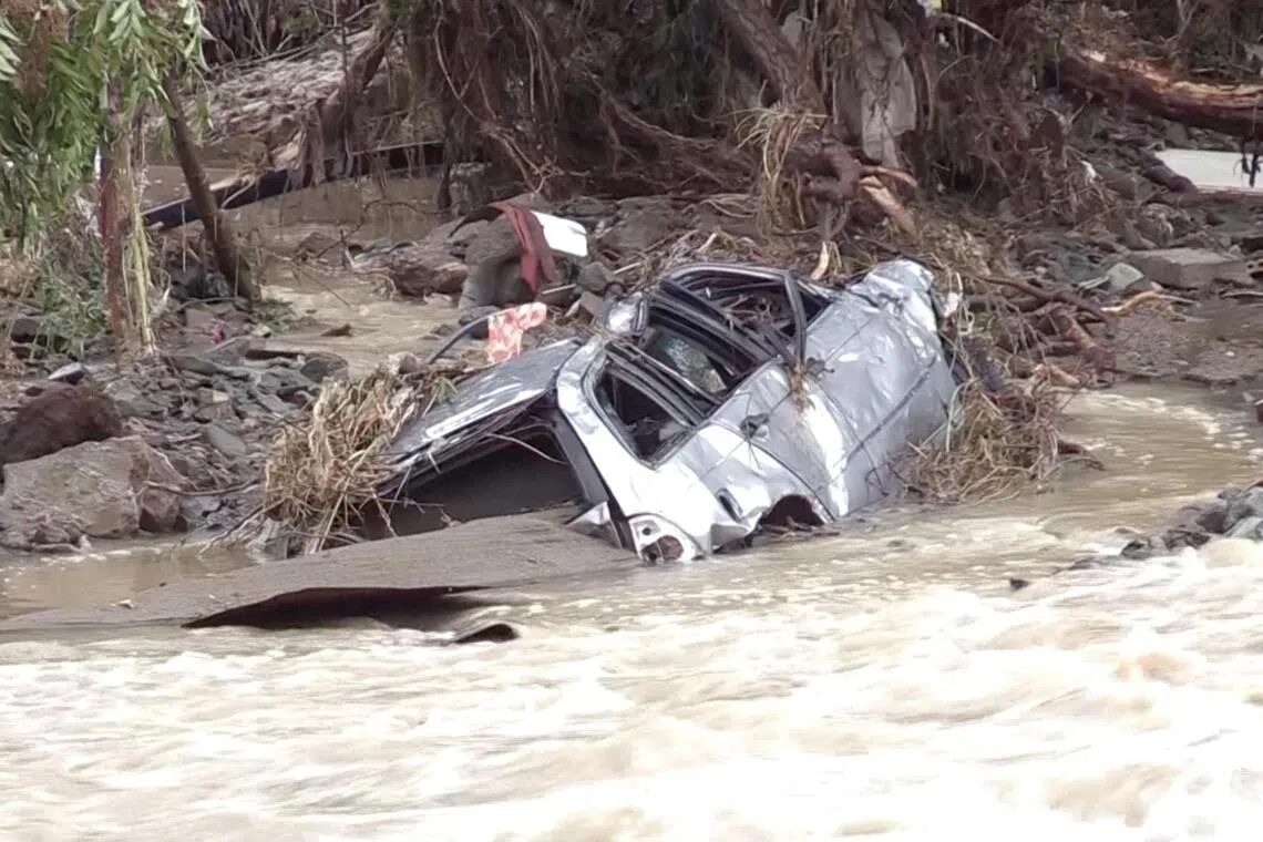 A car partially submerged by floodwater in Tsarevo, Bulgaria, on Oct 3, in a still image taken from video.