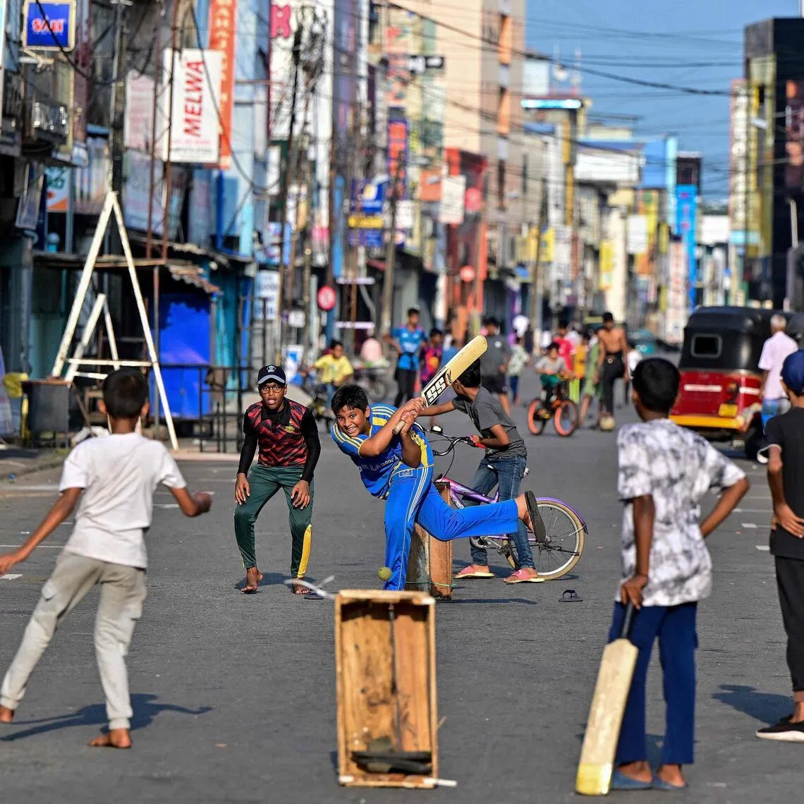 Children playing cricket in Sri Lanka, which is co-hosting the ICC Men’s T20 World Cup with India