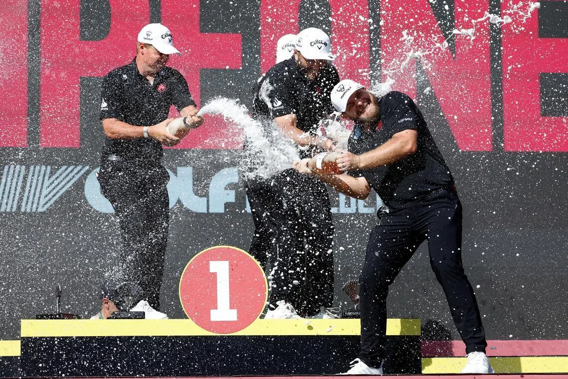 Legion XIII's Tyrrell Hatton celebrating with his teammates Caleb Surratt, Tom McKibbin and Jon Rahm after winning LIV Golf Andalucia on June 7.