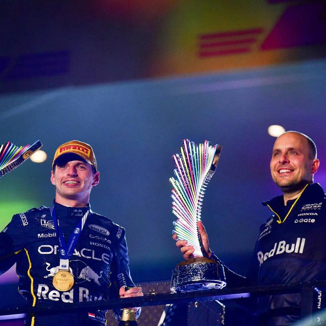 Nov 21, 2025; Las Vegas, NV, USA; Red Bull Racing driver Max Verstappen (1) celebrates his victory with race engineer Gianpiero Lambiase at Las Vegas Strip Circuit. Mandatory Credit: Gary A. Vasquez-Imagn Images