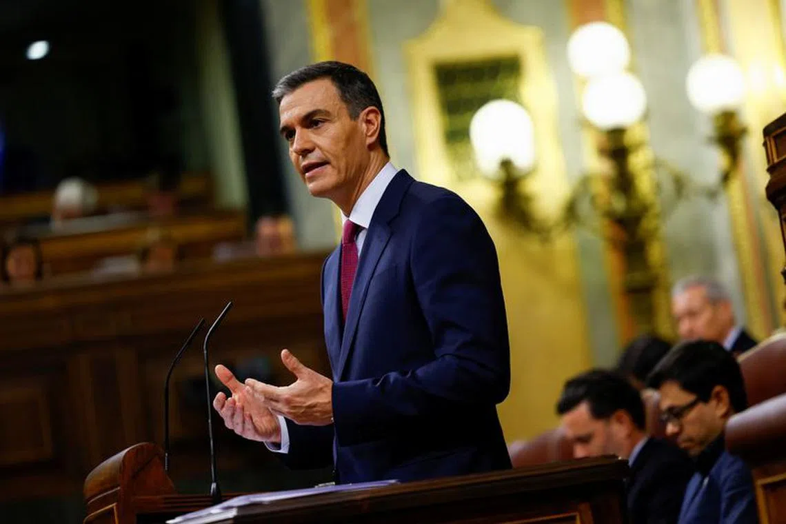 Spain's acting Prime Minister Pedro Sanchez speaks as he attends the investiture debate as Spain's Socialists seek to clinch a new term following a deal with the Catalan separatist Junts party for government support, a pact which involves amnesties for people involved with Catalonia's failed 2017 independence bid, in Madrid, Spain November 15, 2023. REUTERS/Susana Vera