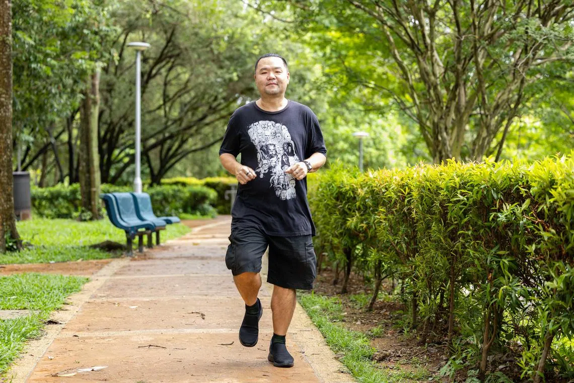 ST20240709_202490387568/azhealthier/Brian Teo/Zhaki Abdullah/Profile of Mr Kenny Lee, 44, IT administrator, exercising in his estate at Ghim Moh Link on July 9, 2024. ST PHOTO: BRIAN TEO.