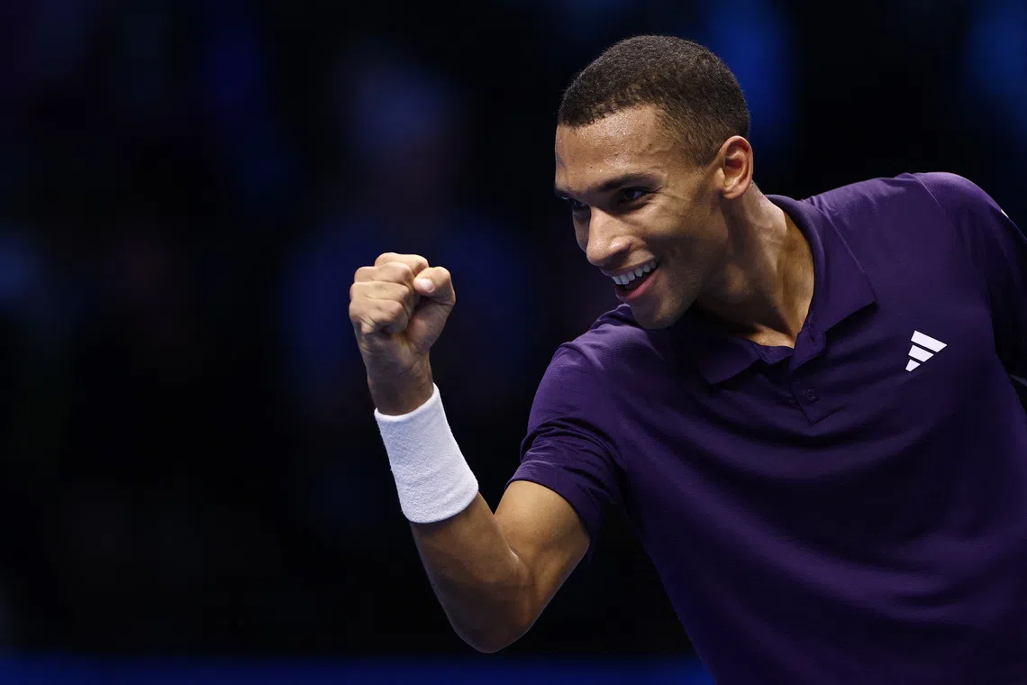 Tennis - ATP Finals - Turin - Palasport Olimpico, Turin, Italy - November 14, 2025 Canada's Felix Auger-Aliassime celebrates after winning his group stage match against Germany's Alexander Zverev REUTERS/Guglielmo Mangiapane