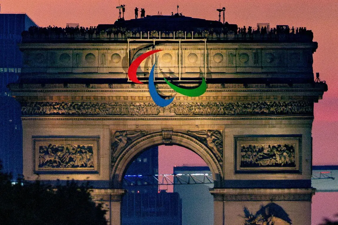 This handout photograph taken and released by OIS/IOC on August 28, 2024, shows the Agitos, the symbol of the Paralympic Games on the Arc de Triomphe during the Paris 2024 Paralympic Games Opening Ceremony in Paris.