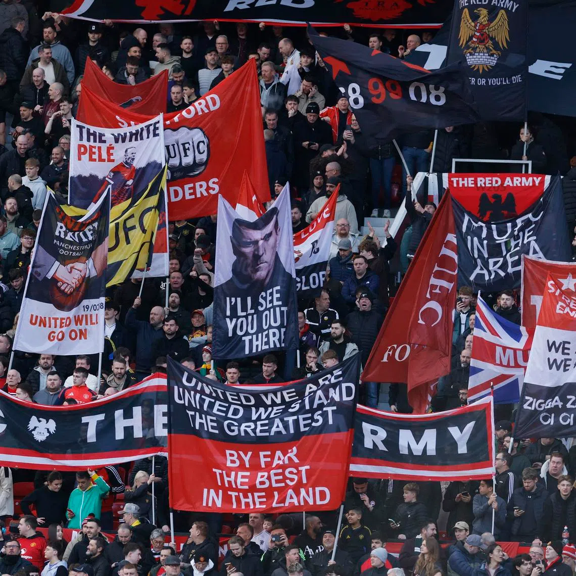 Soccer Football - Premier League - Manchester United v Crystal Palace - Old Trafford, Manchester, Britain - March 1, 2026 Manchester United fans with banners inside the stadium before the match. Action Images via Reuters/Jason Cairnduff