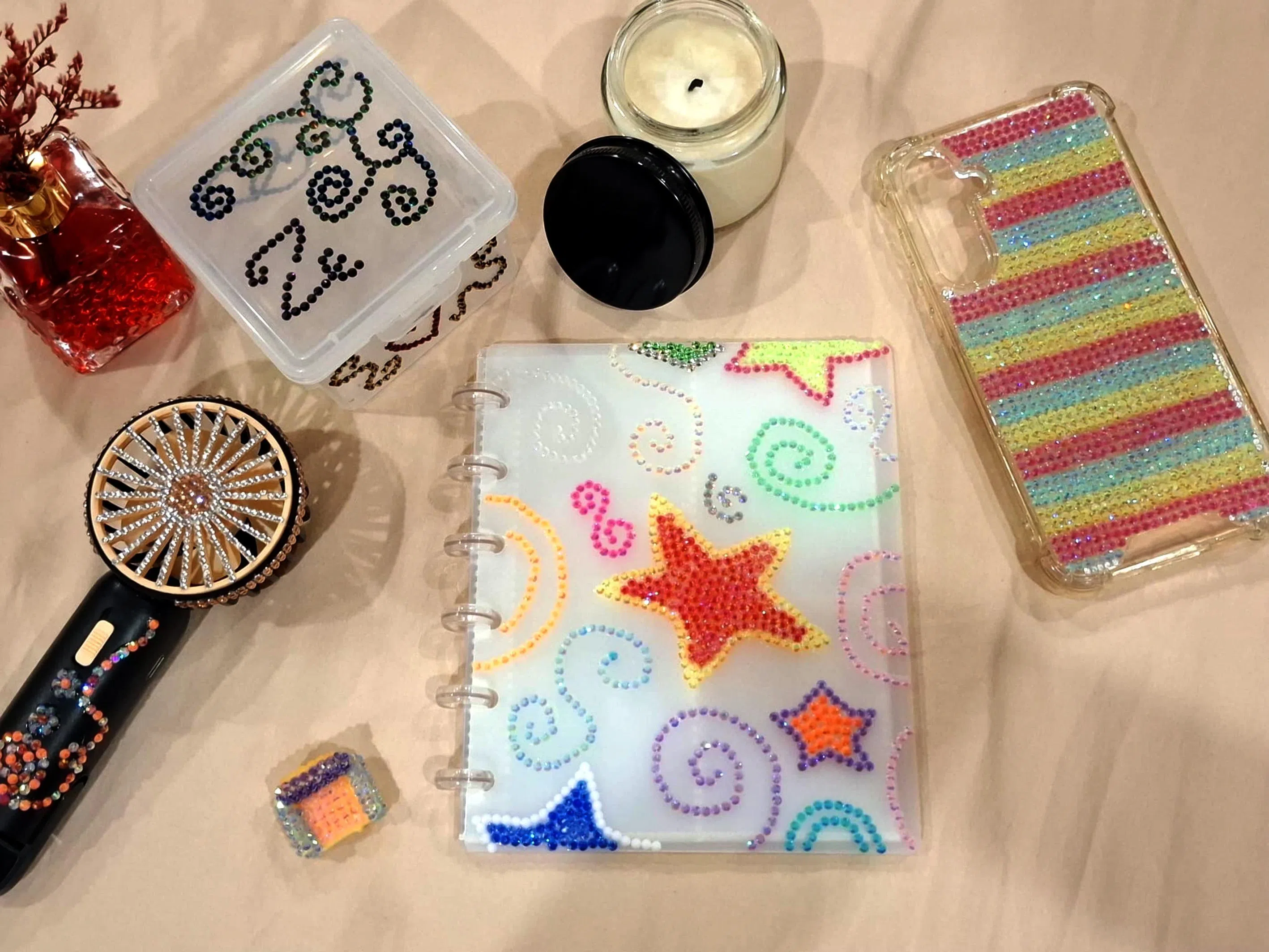 Items bedazzled by Zahira Jahan.