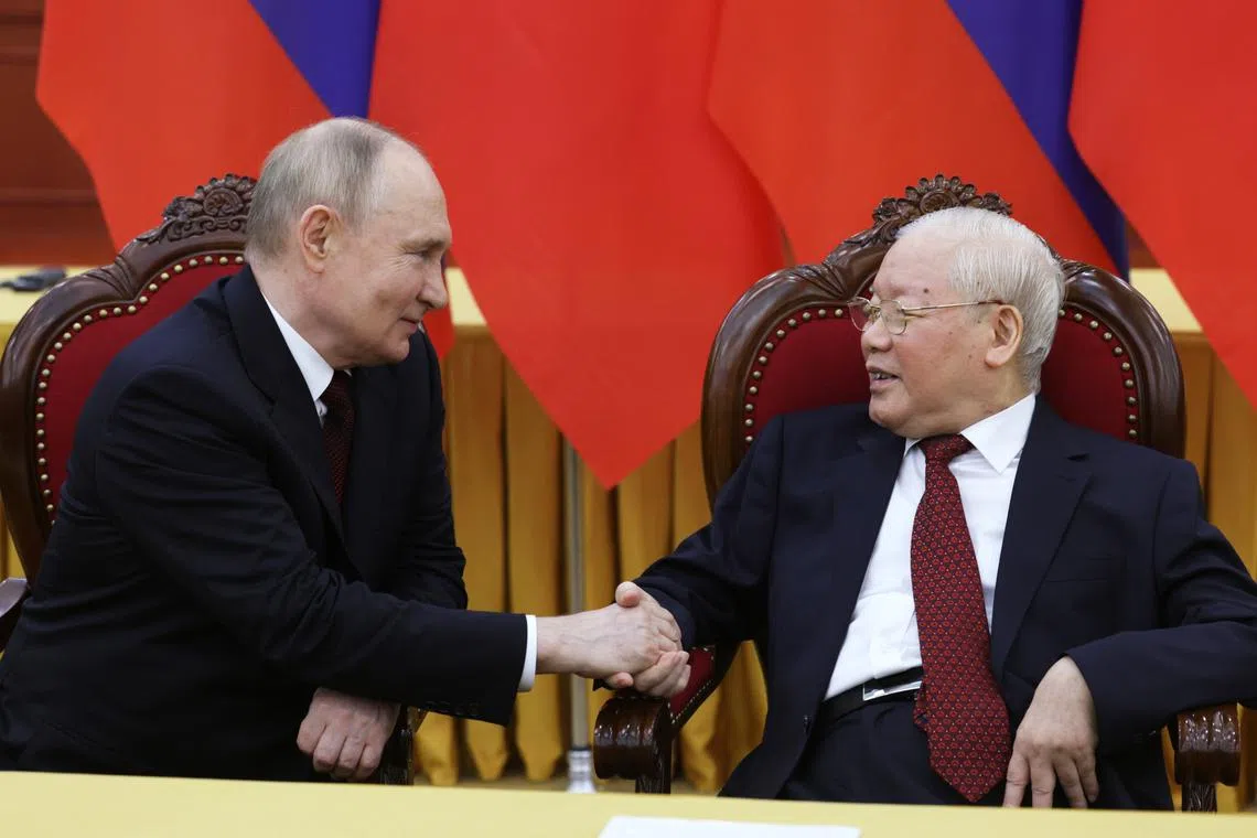 Vietnamese leader Nguyen Phu Trong (right) with Russian president Vladimir Putin at the Communist Party Central Committee headquarters, in Hanoi, on June 20.