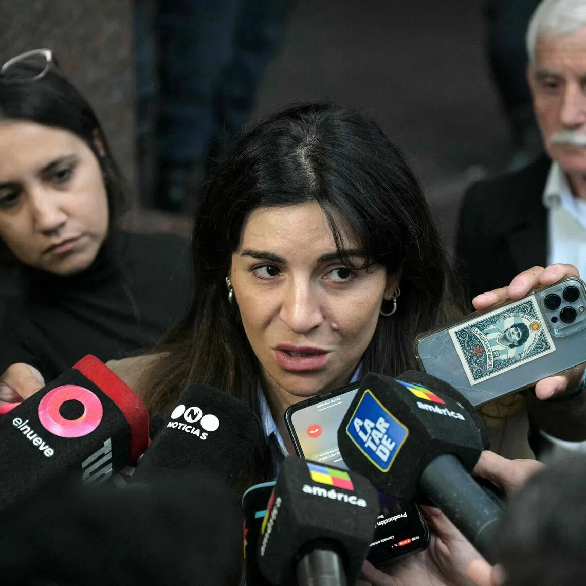 Gianinna Maradona, daughter of Argentine football legend Diego Maradona, speaks to the media outside the court for a trial hearing on her father's death in San Isidro.