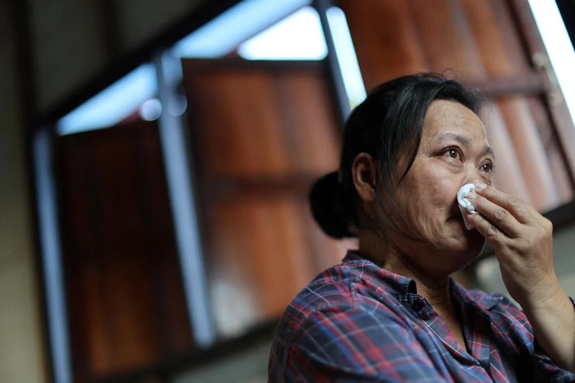 Wiwwaro Sriaoun, 53, a mother of a remaining Thai hostage captured by Hamas, Watchara Sriaoun, reacts during an interview with Reuters, in Kut Yang village, Udon Thani province, Thailand, October 6, 2024. REUTERS/Thomas Suen