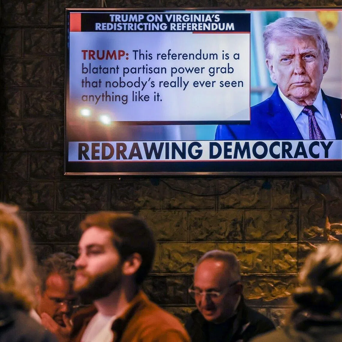 Voters attend an Arlington Democrats redistricting vote watch party during a special election in Arlington, Virginia, on April 21.