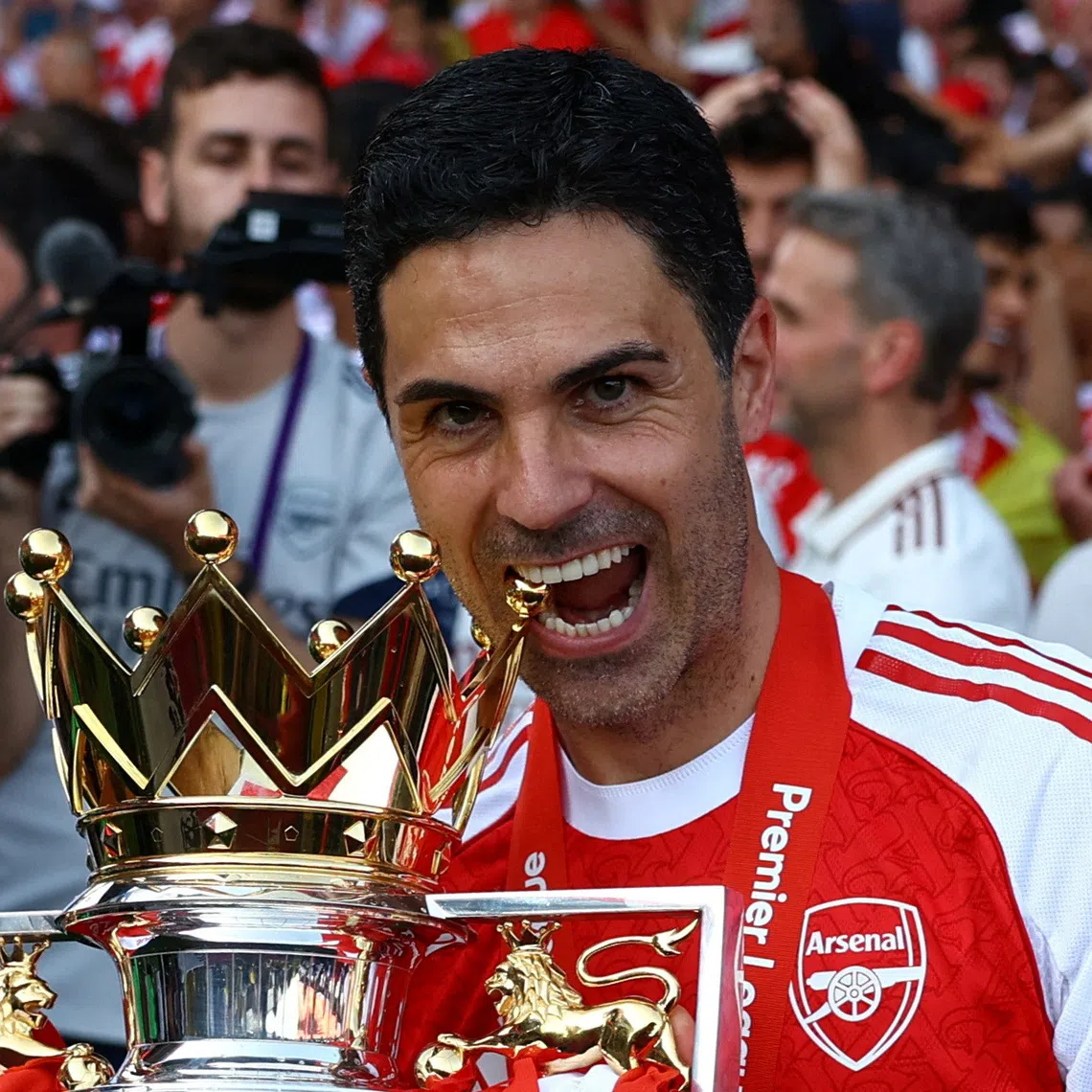 FILE PHOTO: Soccer Football - Premier League - Crystal Palace v Arsenal - Selhurst Park, London, Britain - May 24, 2026 Arsenal manager Mikel Arteta celebrates with the trophy after winning the Premier League Action Images via Reuters/Matthew Childs